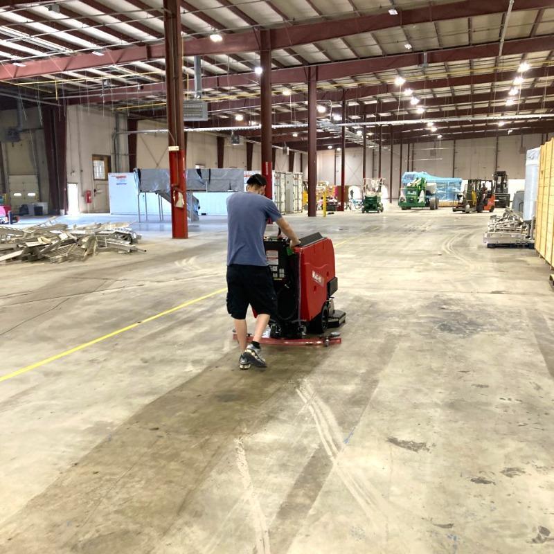 FactoryCat Walk Behind Floor Scrubbers Mag-HD warehouse concrete - https://assets.factorycat.com/demoImages/2025/april/Mag-HD-Walk Behind Floor Scrubbers-warehouse-concrete-Knoxville-USA-326.jpg - 800 - 800 - 326 A FactoryCat Mag-HD walk behind floor scrubber cleans the concrete floors in a warehouse outside Knoxville, Tennessee.