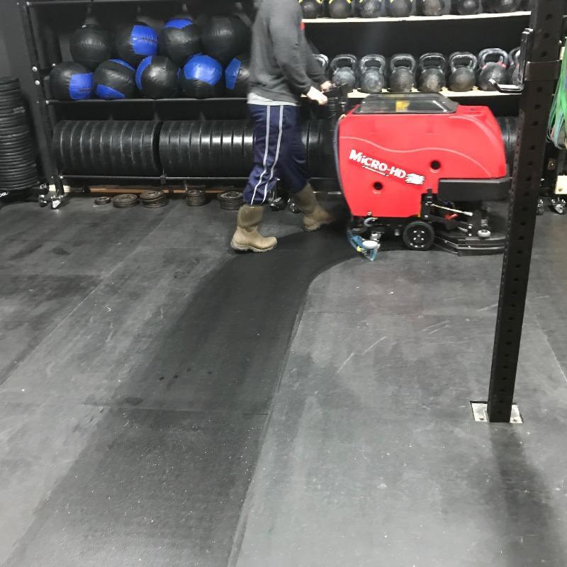 FactoryCat Walk Behind Floor Scrubbers Micro-HD gymnasium rubber flooring - https://assets.factorycat.com/demoImages/2025/april/Micro-HD-Walk Behind Floor Scrubbers-gymnasium-rubber flooring-Indianappolis-USA-939.jpg - 800 - 800 - 939 A FactoryCat Micro-HD walk behind floor scrubber cleans the rubber floor in the workout room of a Indianapolis, Indiana CrossFit gym