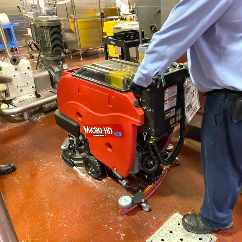 FactoryCat Walk Behind Floor Scrubbers Micro-HD production floor epoxy - https://assets.factorycat.com/demoImages/2025/april/Micro-HD-Walk Behind Floor Scrubbers-production floor-epoxy-Baltimore-USA-337.jpg - 800 - 800 - 337 A FactoryCat Micro-HD battery floor scrubber cleaning the epoxy production floor of a bakery in Baltimore, Maryland.