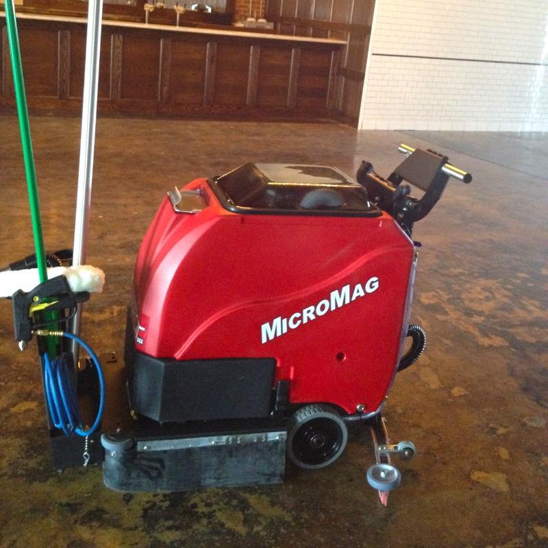 FactoryCat Walk Behind Floor Scrubbers MicroMag banquet hall concrete - https://assets.factorycat.com/demoImages/2025/april/MicroMag-Walk Behind Floor Scrubbers-banquet hall-concrete-Fon Du Lac-USA-746.jpg - 800 - 800 - 746 MicroMag Walk Behind Floor Scrubber cleaning the concrete floor of a banquet hall at a Wisconsin fair grounds