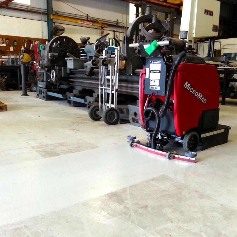 FactoryCat Walk Behind Floor Scrubbers MicroMag maintenance shop epoxy - https://assets.factorycat.com/demoImages/2025/april/MicroMag-Walk Behind Floor Scrubbers-maintenance shop-epoxy-Melbourne-USA-583.jpg - 800 - 800 - 583 MicroMag Walk Behind Floor Scrubbers cleaning the epoxy floor in an aviation maintenance shop in Melbourne, Florida