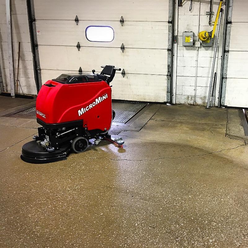 FactoryCat Walk Behind Floor Scrubbers MicroMini loading dock concrete - https://assets.factorycat.com/demoImages/2025/april/MicroMini-Walk Behind Floor Scrubbers-loading dock-concrete-Muncie-USA-858.jpg - 800 - 800 - 858 A FactoryCat MicroMini Walk Behind Floor Scrubber cleans the concrete loading dock floor of a Muncie, Indiana 3PL