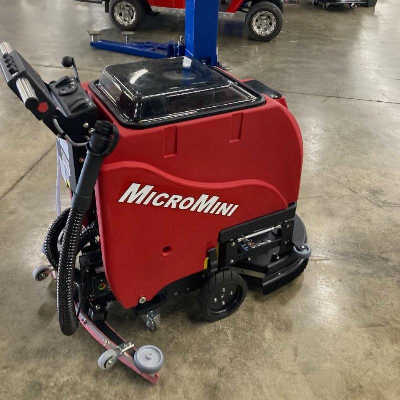 FactoryCat Walk Behind Floor Scrubbers MicroMini maintenance shop concrete - https://assets.factorycat.com/demoImages/2025/april/MicroMini-Walk Behind Floor Scrubbers-maintenance shop-concrete-Atlanta-USA-366.jpg - 800 - 800 - 366 A FactoryCat MicroMini battery floor scrubber cleaning the concrete floor of a college maintenance shop, in Atlanta, GA