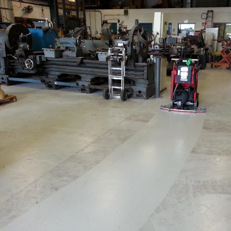 FactoryCat Walk Behind Floor Scrubbers MicroMini production floor epoxy - https://assets.factorycat.com/demoImages/2025/april/MicroMini-Walk Behind Floor Scrubbers-production floor-epoxy-Cleveland-USA-871.jpg - 800 - 800 - 871 A FactoryCat MicroMini Walk Behind Floor Scrubber cleans the dirty and oily epoxy floor in a Cleveland, Ohio machine shop