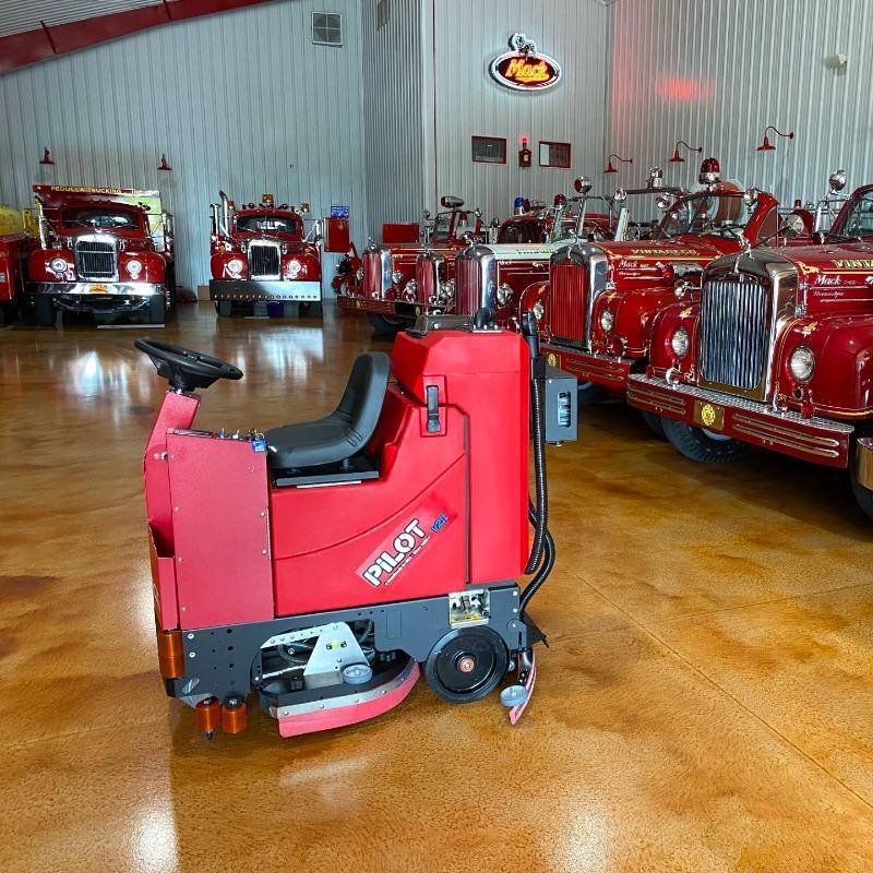 FactoryCat Ride On Floor Scrubbers Pilot garage epoxy - https://assets.factorycat.com/demoImages/2025/april/Pilot-Ride On Floor Scrubbers-garage-epoxy-Phillidephia-USA-608.jpg - 800 - 800 - 608 Pilot battery Ride On Floor Scrubbers cleaning a fire engine museum in Pennsylvania