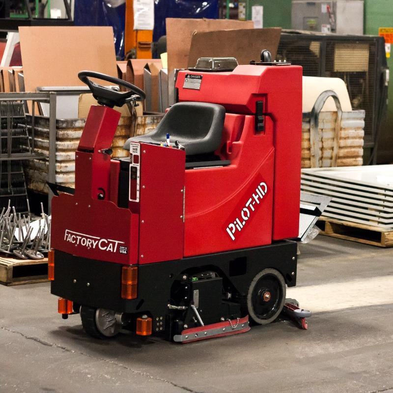 FactoryCat Ride On Floor Scrubbers Pilot production areas concrete - https://assets.factorycat.com/demoImages/2025/april/Pilot-Ride On Floor Scrubbers-production areas-concrete-Bentonville-USA-841.jpg - 800 - 800 - 841 A FactoryCat Pilot Ride On Floor Scrubber cleans the concrete floor of the production area in a Bentonville, Arkansas metal fabrication shop